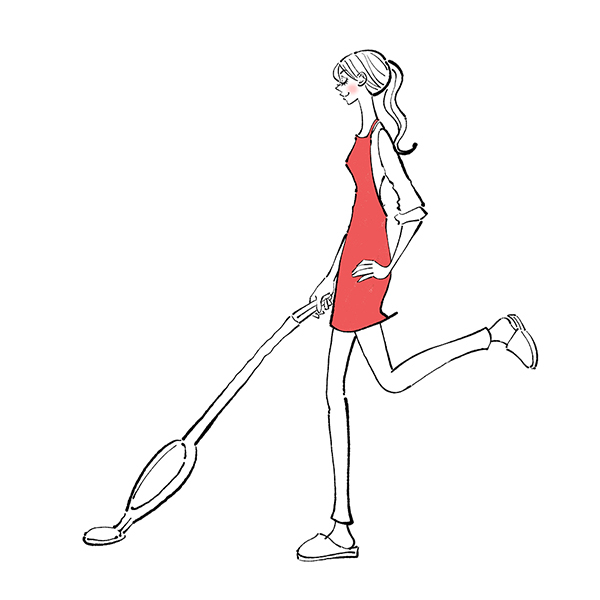 掃除機をかける女性
